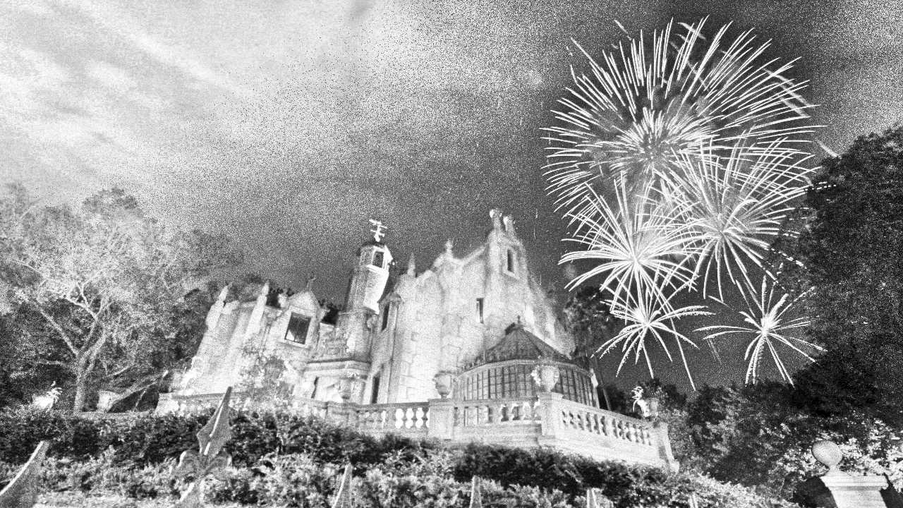 The Haunted Mansion at Walt Disney World with fireworks in background