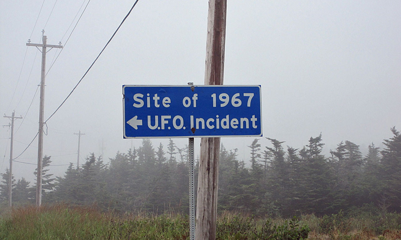 A sign which reads 'Site of 1967 UFO Incident'