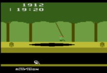 Screencap of Pitfall! on Atari 2600; Pitfall Harry swings on a rope