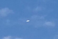 Alleged UFO above Detroit. Disc-like and bright white.